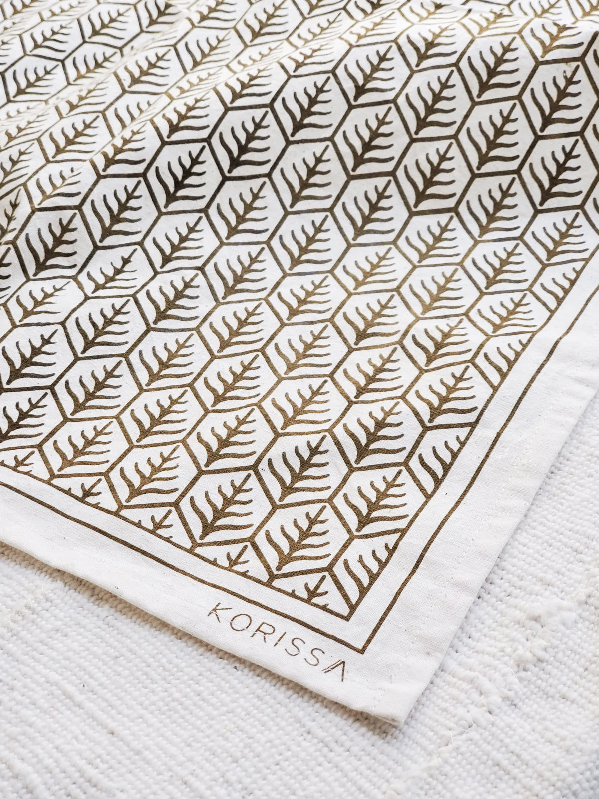 Printed tea towels with closeup of Korissa label