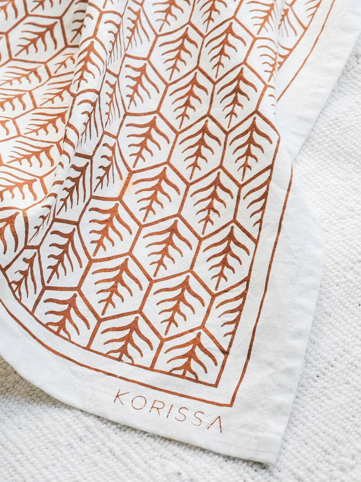 Printed tea towels with closeup of Korissa label