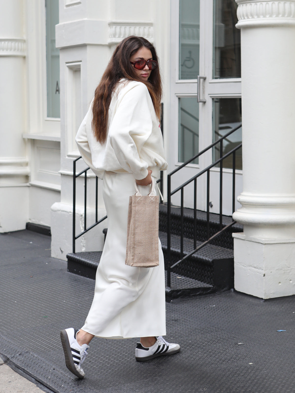 model holding canvas wine bag