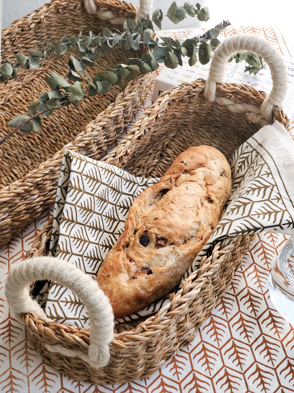 Bread basket with bread and towel